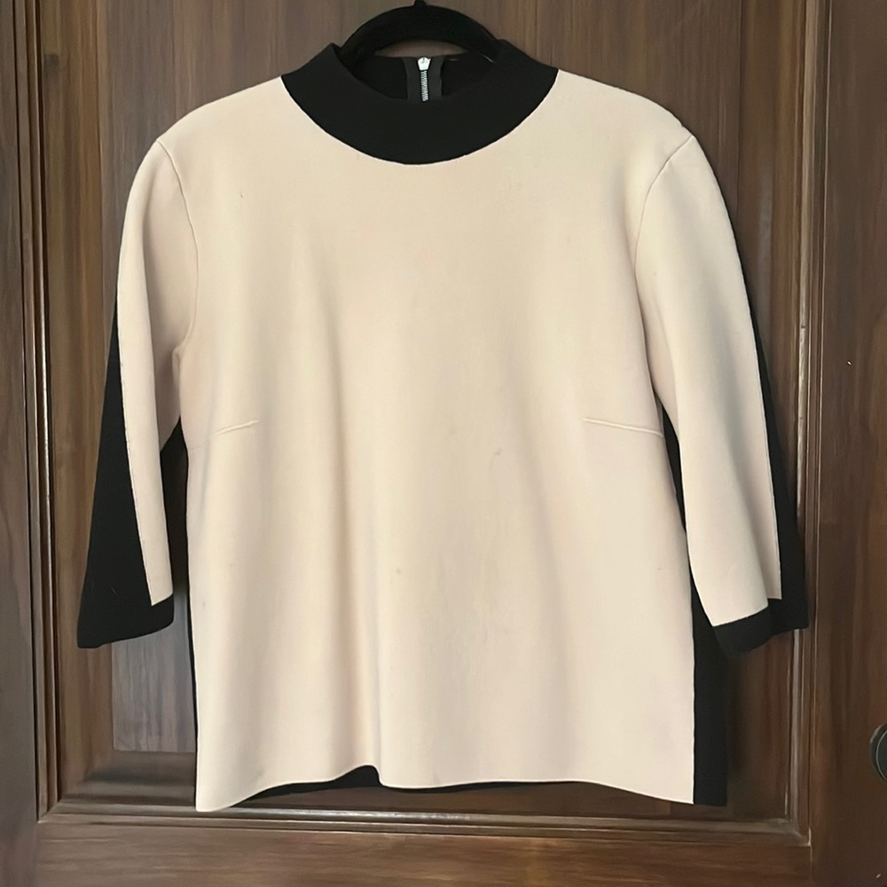 D. Exterior tan and black Italian sweater